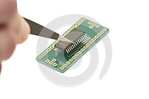 Insert microchip memory into adapter SMD twith tweeze