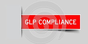 Inserted red sticker label with word GLP Good Laboratory Practice compliance on gray background