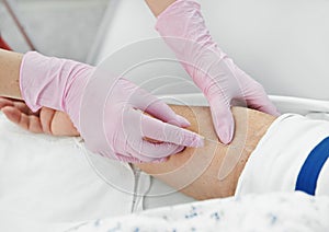 Inserting a needle through the skin for injection