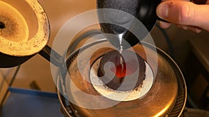 Insertion of raw gold in a furnace