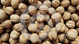 Inshell walnuts as background