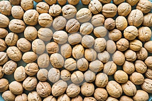 Inshell walnuts background. View from above.