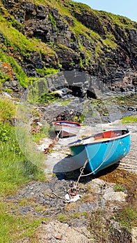 Inshore fishing boats on stone jetty