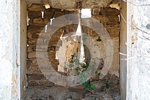 Inside an abandoned old house, uninhabitable. The wall collapsed