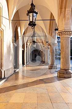 Inside the arches of Cloth Hall in Cracow, Poland old town at sunrise