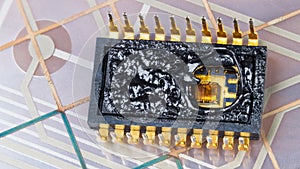 Inside of burned integrated circuit on flexible PCB membrane detail