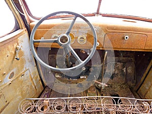 Inside cab view of rusty old junked pickup truck