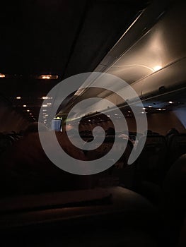 Inside cabin of airplane at night dark