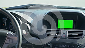Inside a Car. A GPS Module is On. Green Screen