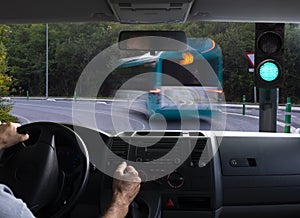 Inside car view of a green traffic light