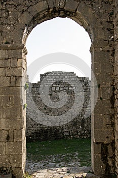 Inside the castle - view of the ancient castle`s door with arch, Shkoder, Albania