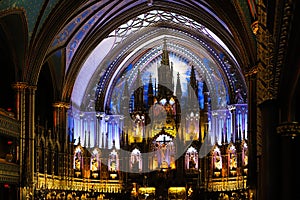 Inside the Catholic church is an altar with icons and lamps. organ, ancient decoration, Gothic, stained glass windows, columns.