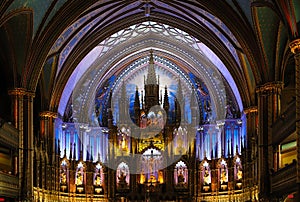 Inside the Catholic church is an altar with icons and lamps. organ, ancient decoration, Gothic, stained glass windows, columns.