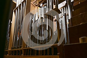 Inside a church organ, register with different pipes from metal, musical instrument