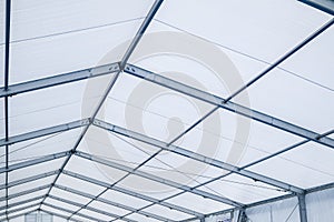 Inside a clear blue span marquee aluminium framework marquee