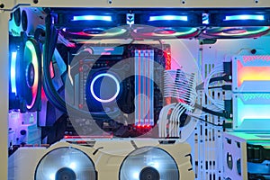 Inside Desktop PC Gaming and Cooling Fan CPU system with multicolored LED RGB light show statu