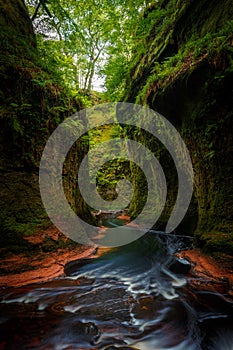 Inside of the DevilÃ¢â¬â¢s Pulpit gorge, with running water