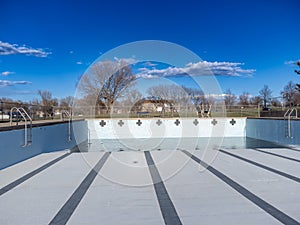 inside an empty and drained winterized swimming pool