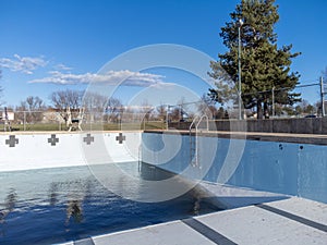 inside an empty and drained winterized swimming pool