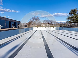 inside an empty and drained winterized swimming pool