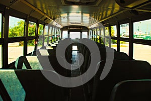 Inside of empty school bus without children the view from the front of the schoolbus