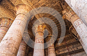 Inside Esna Temple, the imposing columns adorned with hieroglyphs stretch towards the ornate ceiling. photo