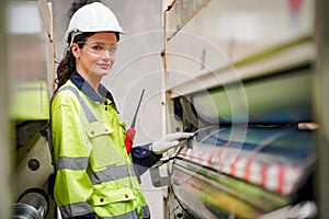 Inside a factory, industrial worker in action on machine.