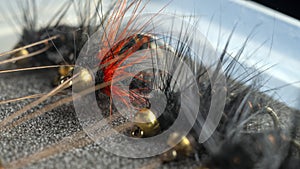The inside of a fisherman`s flybox, with an assortment of hand-tied trout flies