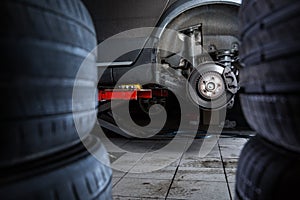 Inside a garage - modern car waiting for the mechanic