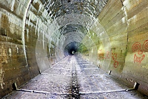 Inside of a grungy tunnel photo