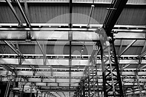 Inside an industrial building with iron beams