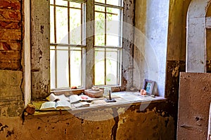 Inside interior of an old abandoned church in Latvia, Galgauska, icon and candle on the windowsill