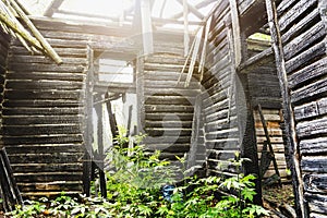 Inside interior of old abandoned wooden burned out mansion building