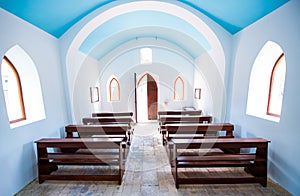 Inside interiors of small generic church.