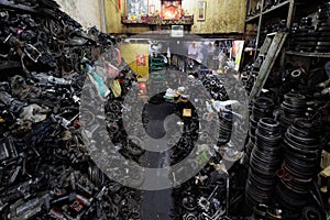 Inside a messy vehicle part shop in Bangkok\'s Chinatown