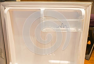 Inside mini refrigerator in empty condition