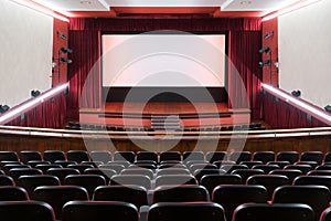 Inside of movie theatre with empty seats and stage