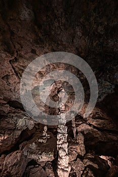 Inside the mysterious flowstone cave `NebelhÃ¶hle` with stalagmites and stalactites in Germany