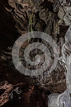 Inside the mysterious flowstone cave `NebelhÃ¶hle` with stalagmites and stalactites in Germany