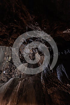 Inside the mysterious flowstone cave `NebelhÃ¶hle` with stalagmites and stalactites in Germany