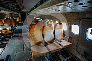 Inside of old abandoned passenger airplane. Plane wreck