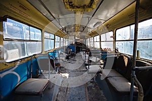 Inside old abandoned rusty wrecked bus or trolleybus
