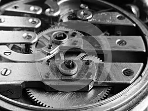 The inside of an old clock. Pocket watches from the inside. Gears in a pocket watch. macro photography - black and white