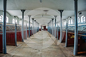 Inside old German stable or barn with horse boxes