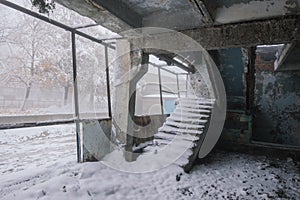 Inside old ruined abandoned industrial building in the fog