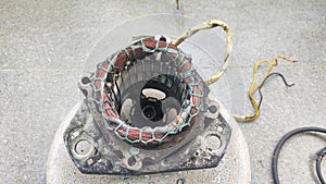The inside of the old and rusty dynamo is a coil of wire on the dynamo