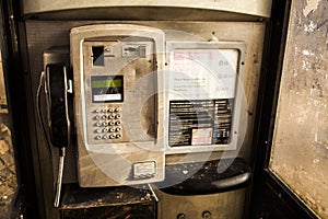 inside of one public phone box in UK. Red Telephone box.