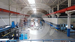 Inside the plant for the production of steel materials. Scene. Modern manufacturing storage with machine tools, roller