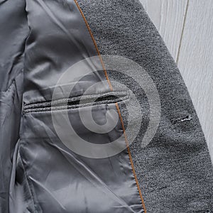 Inside pocket of a classic gray blazer for men. close-up. fashion clothes details close-up