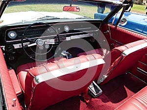 Inside red convertible Chevrlet Impala SS in Lima